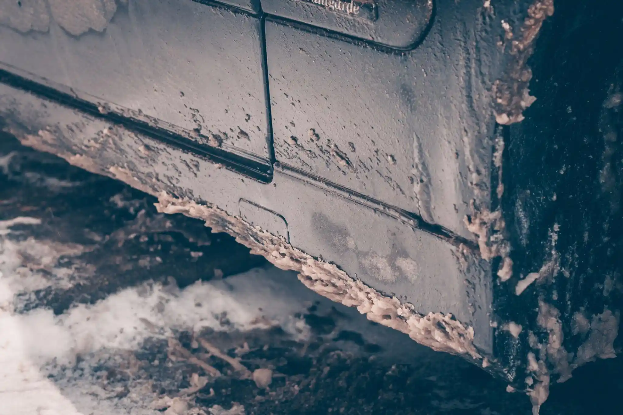 dirty car covered in winter road salt and grime London